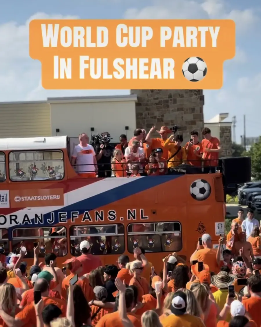 Orange World Cup party bus and crowd in Fulshear